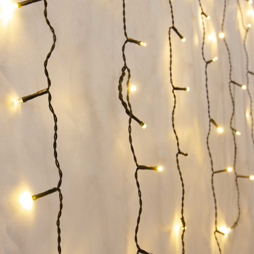 200 Led λαμπάκια 20% flashing σε επεκτεινόμενη συμμετρική κουρτίνα με πράσινο καλώδιο και θερμό λευκό φως 1.5x1.8μ